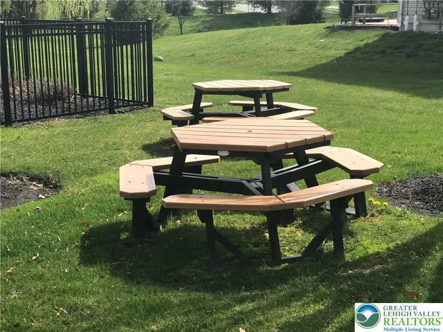 a view of a table and chairs in the garden
