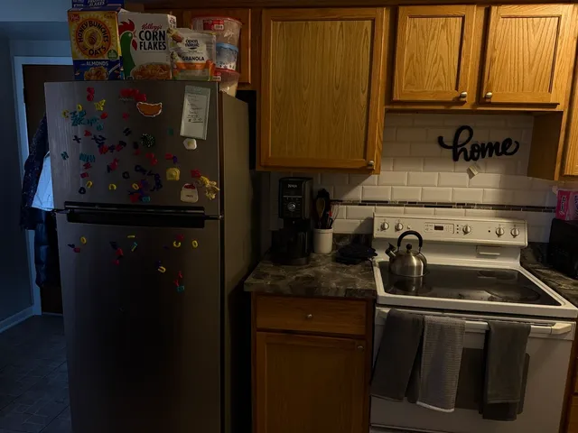a kitchen with a stove and cabinets