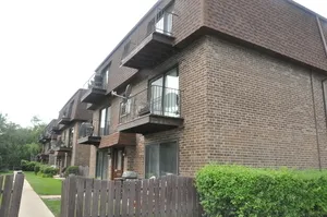 a view of a house with more brick walls