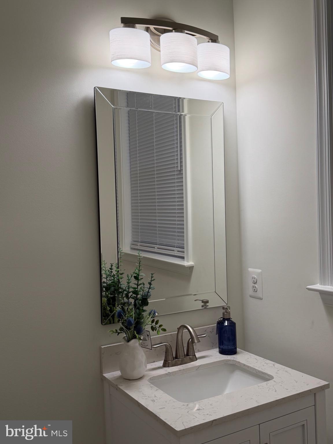 229 Bibb Street Louisa, VA 23093 - Photo 22 of 72 a bathroom with a sink and a mirror