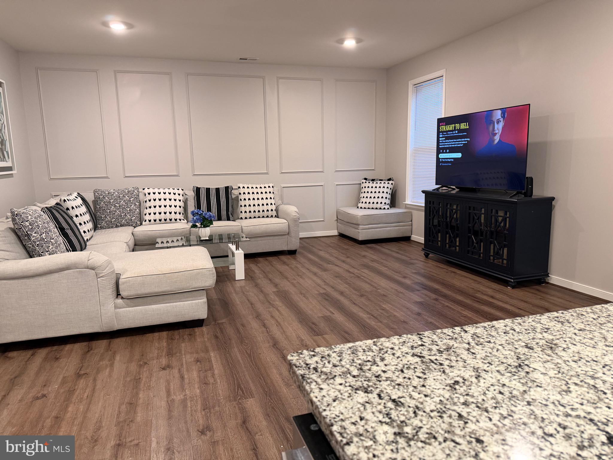 229 Bibb Street Louisa, VA 23093 - Photo 23 of 72 a living room with furniture and a flat screen tv