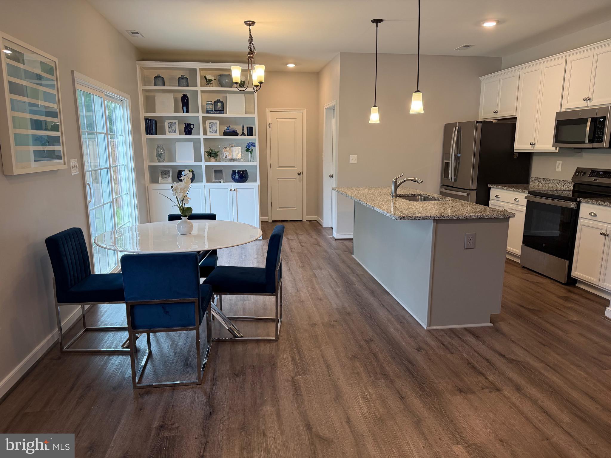 229 Bibb Street Louisa, VA 23093 - Photo 26 of 72 a large kitchen with a table and chairs in it