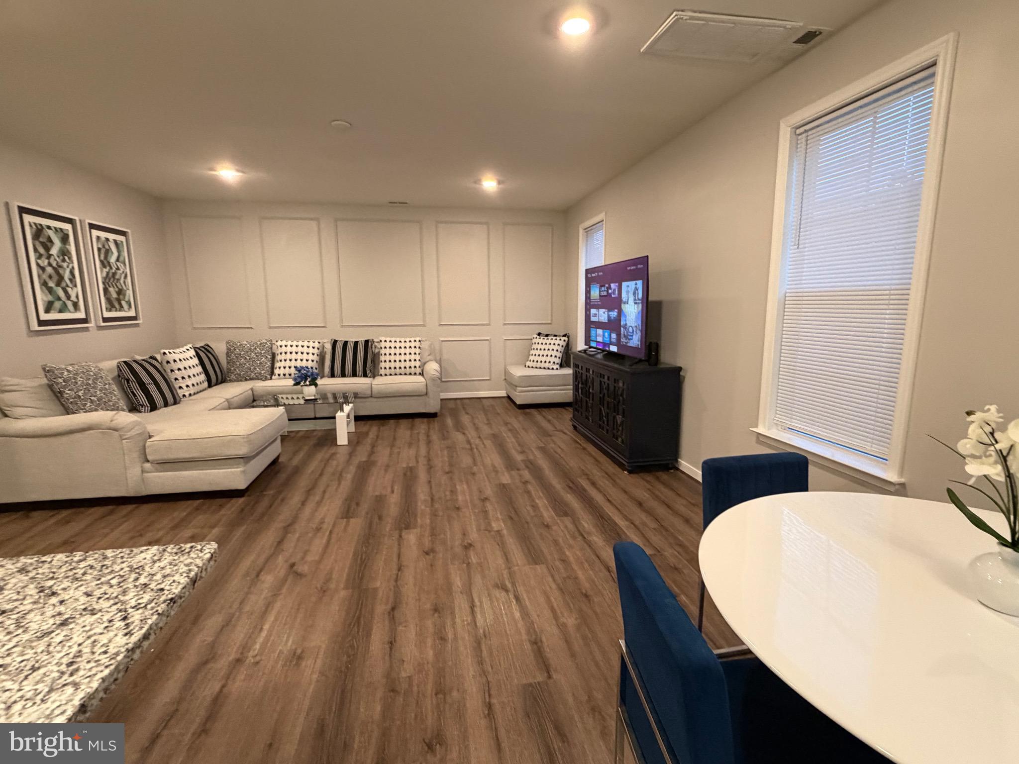 229 Bibb Street Louisa, VA 23093 - Photo 36 of 72 a living room with furniture and a wooden floor
