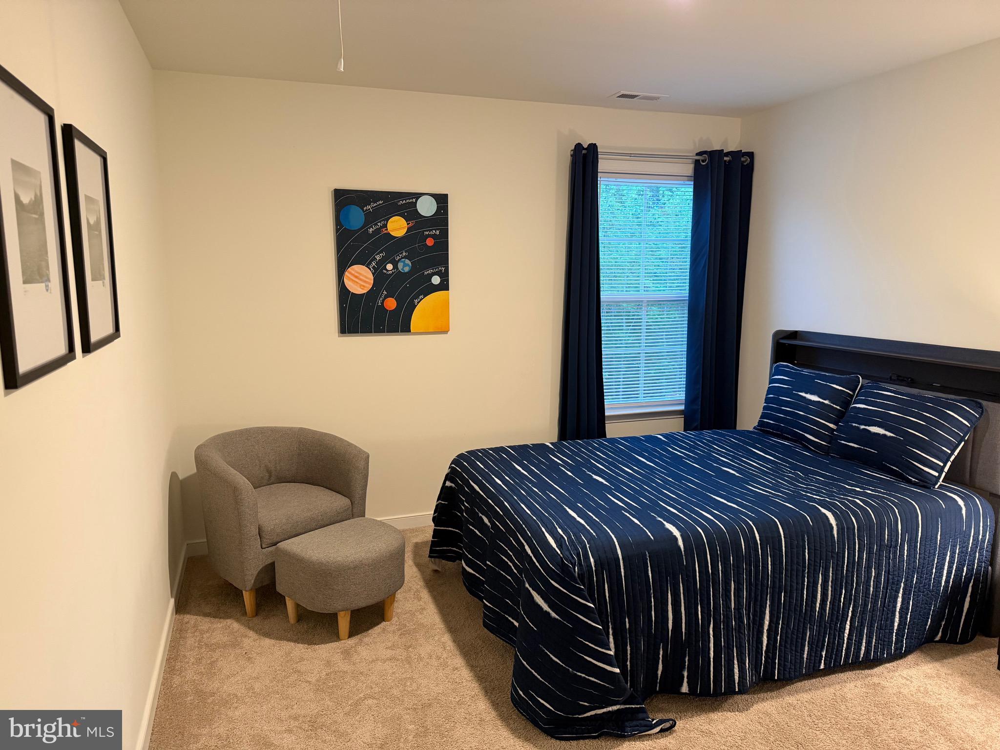 229 Bibb Street Louisa, VA 23093 - Photo 45 of 72 a bedroom with a bed and chair