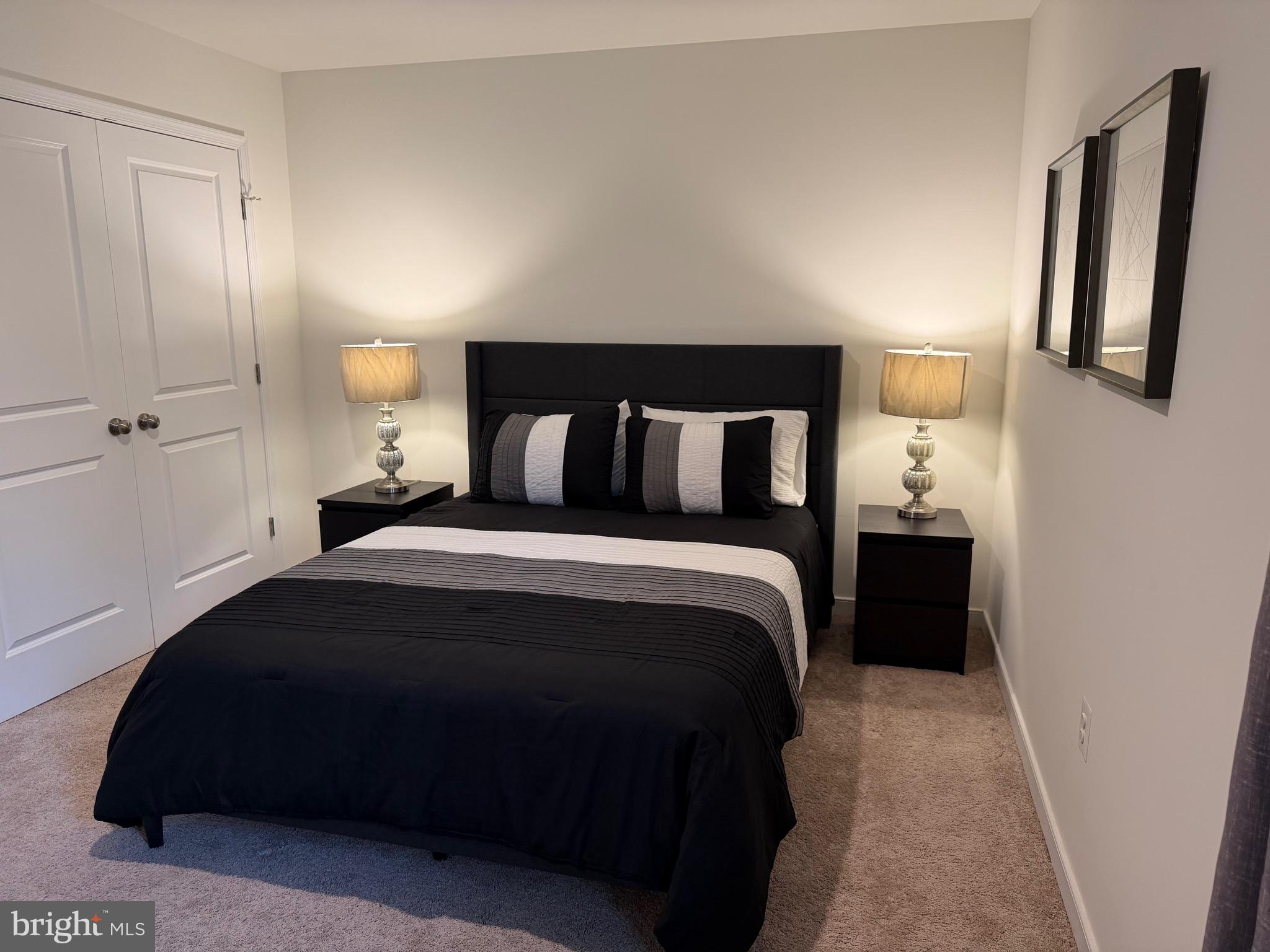229 Bibb Street Louisa, VA 23093 - Photo 49 of 72 a bedroom with a bed and a walk in closet