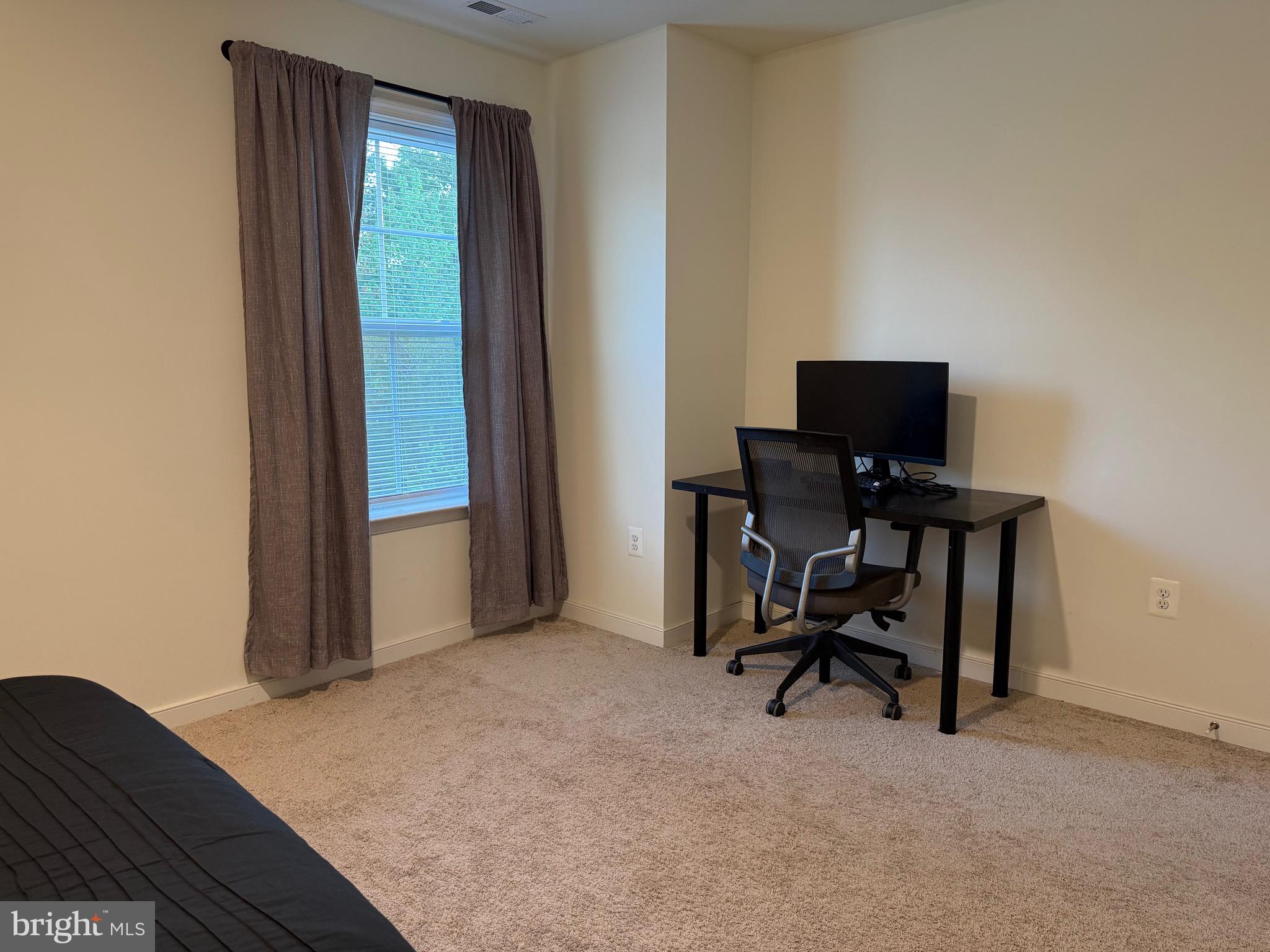 229 Bibb Street Louisa, VA 23093 - Photo 50 of 72 a view of a workspace with furniture and a window