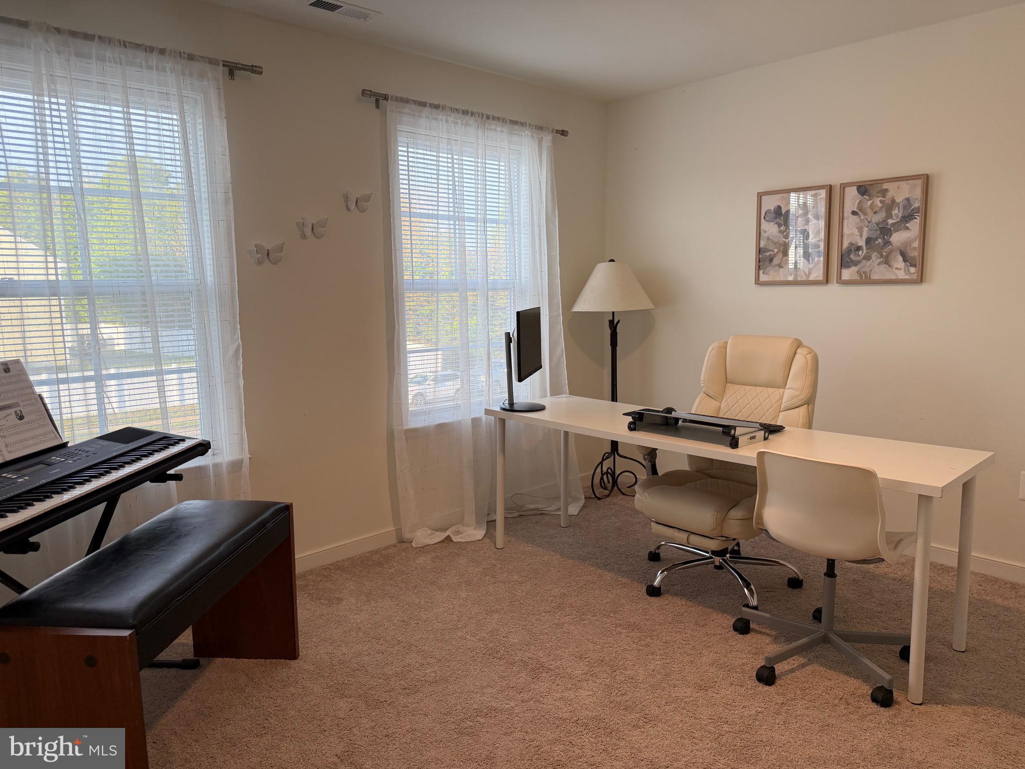 229 Bibb Street Louisa, VA 23093 - Photo 54 of 72 a view of a workspace with furniture and a window