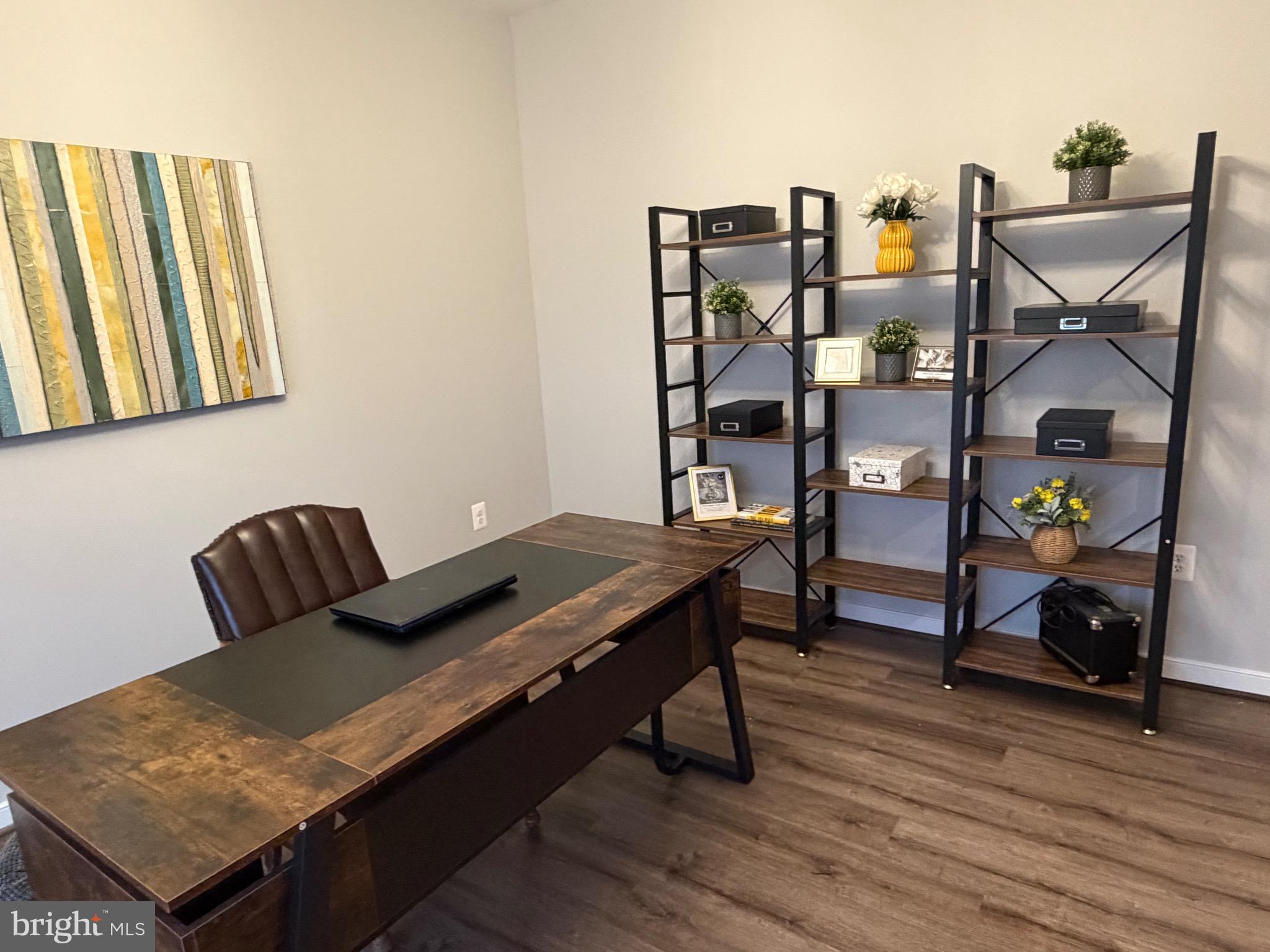 229 Bibb Street Louisa, VA 23093 - Photo 6 of 72 a view of a workspace with furniture and wooden floor