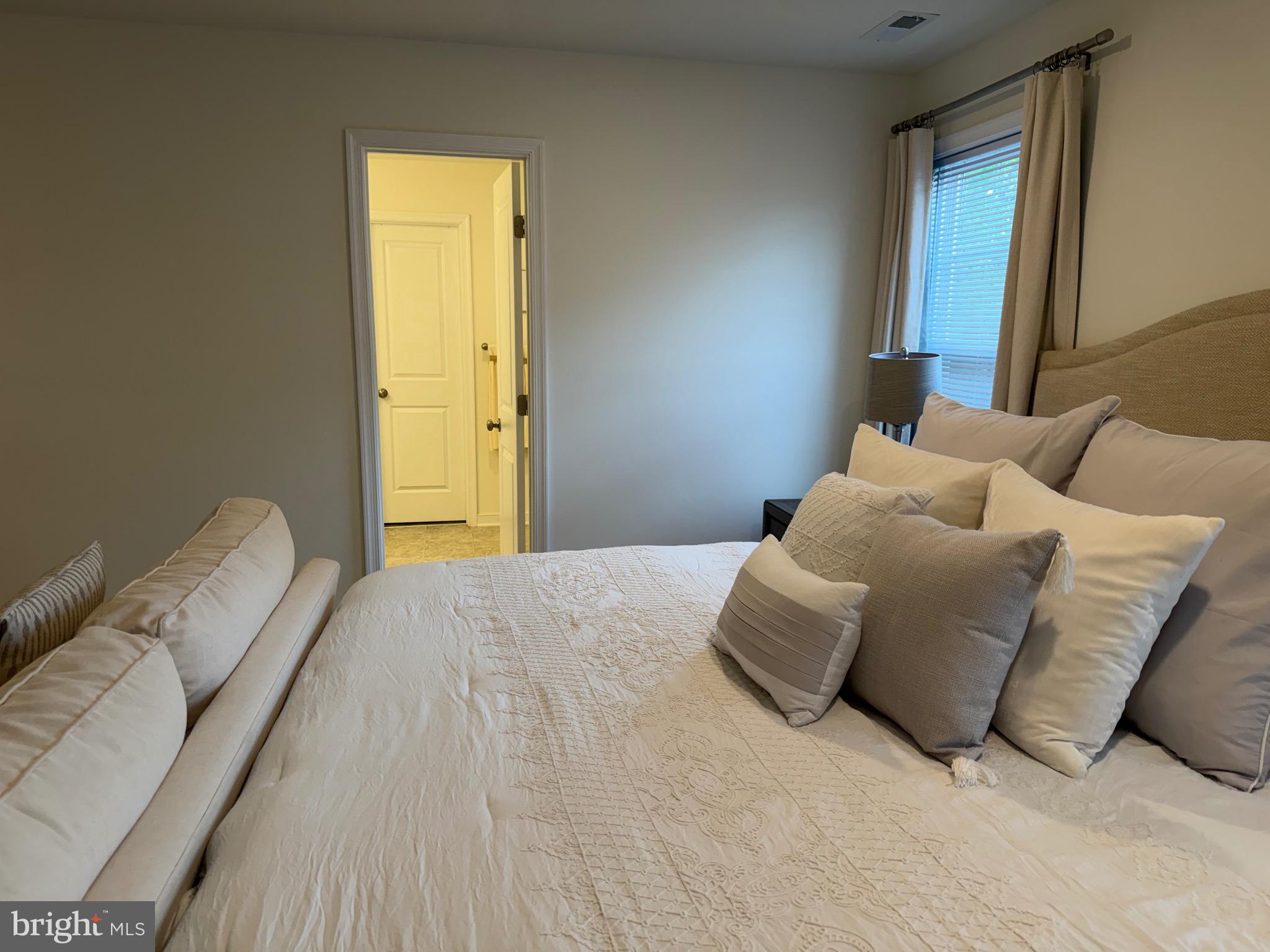 229 Bibb Street Louisa, VA 23093 - Photo 64 of 72 a bedroom with a bed and a window