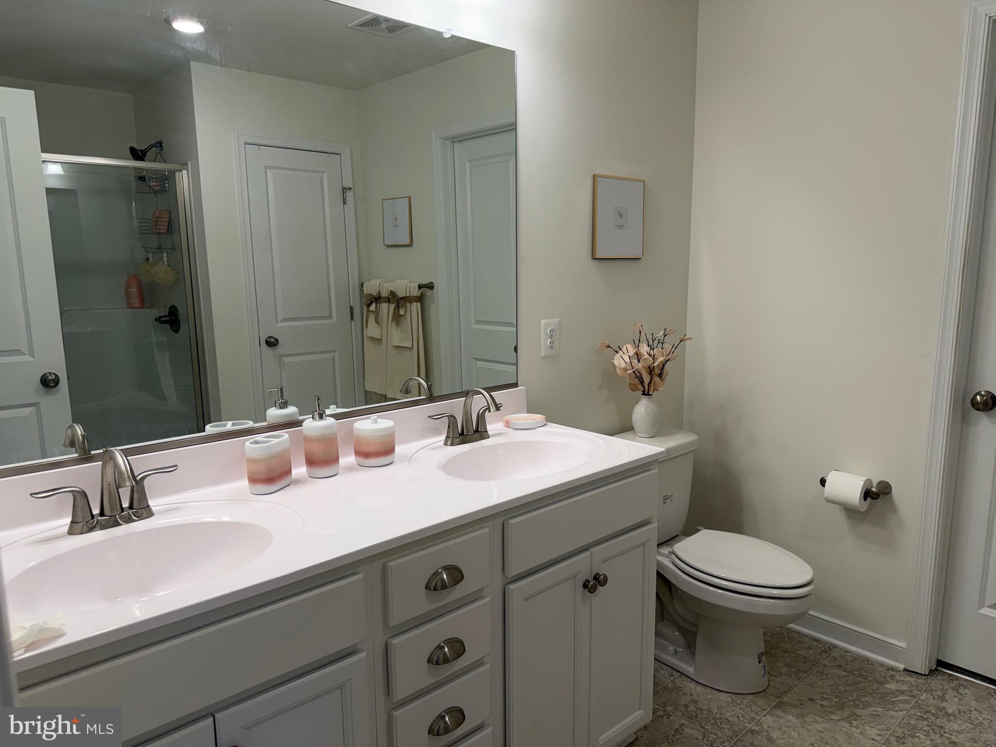 229 Bibb Street Louisa, VA 23093 - Photo 66 of 72 a bathroom with a toilet sink and mirror