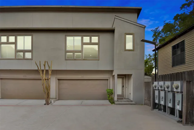 a front view of a house with garage