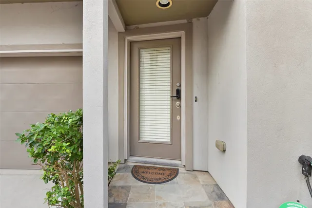 a view of a bathroom with a sink and a mirror