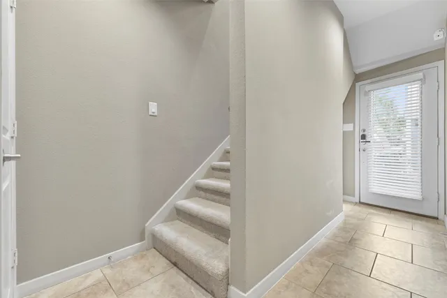 a view of entryway with stairs