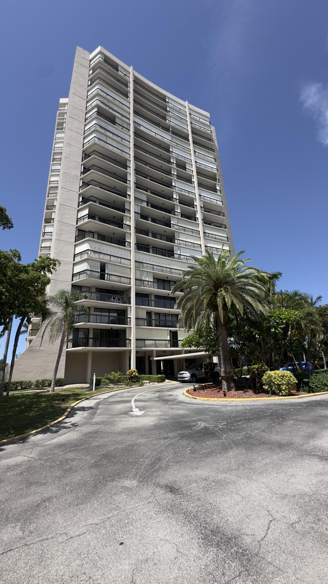 2425 Presidential Way, Unit 203 West Palm Beach, FL 33401 - Photo 1 of 35 a front view of a building