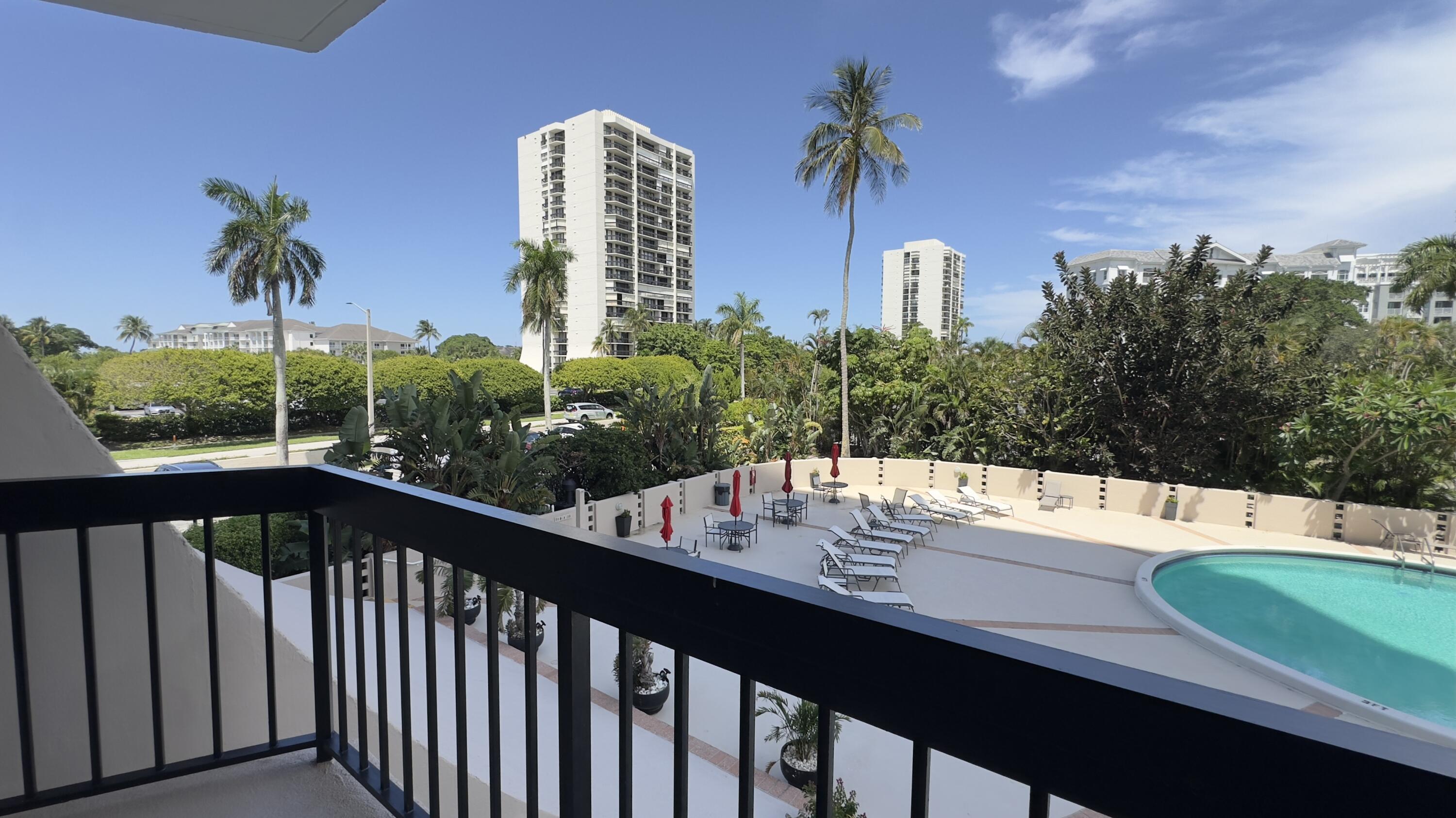 2425 Presidential Way, Unit 203 West Palm Beach, FL 33401 - Photo 21 of 35 a view of a swimming pool with a balcony