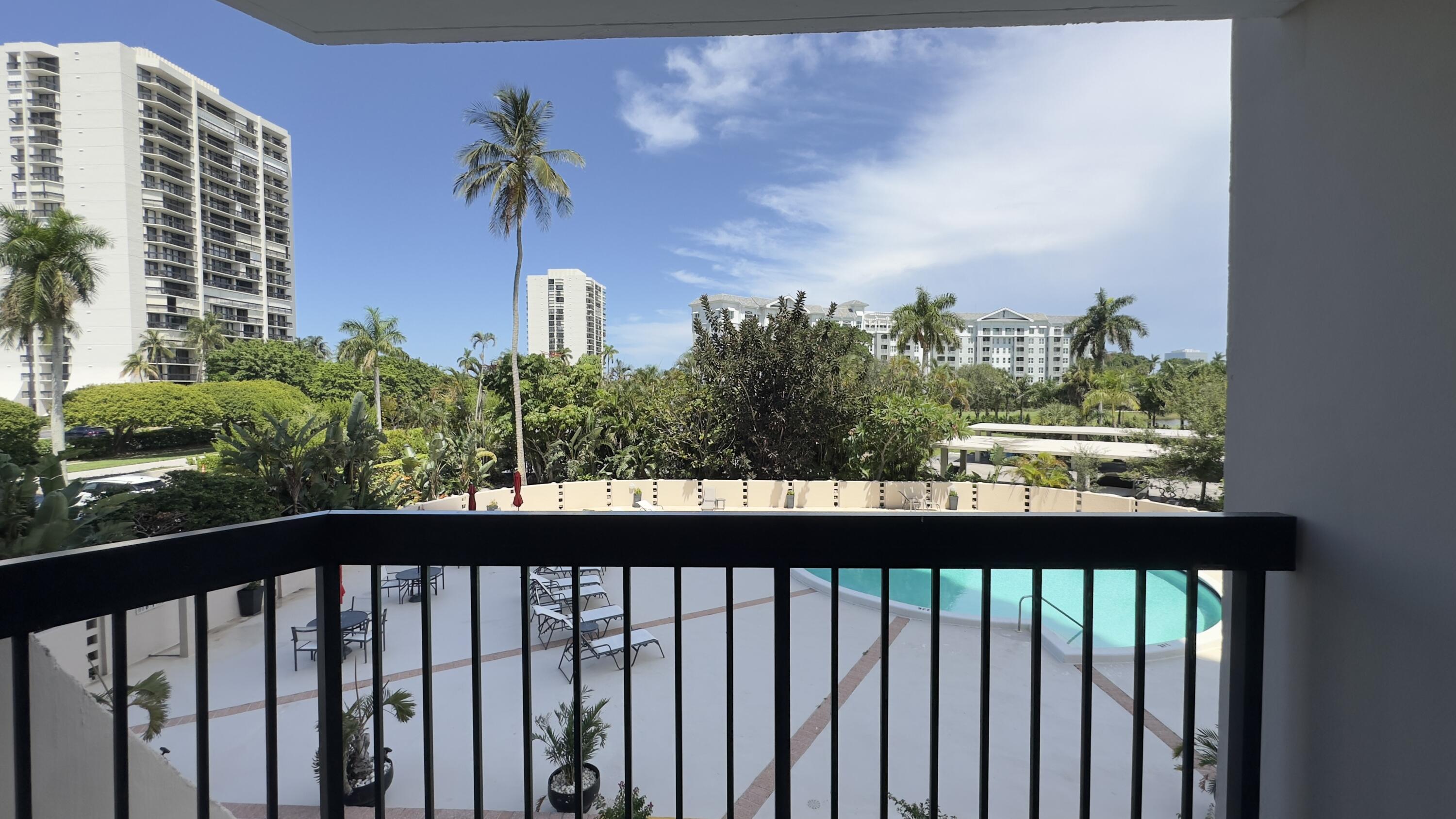 2425 Presidential Way, Unit 203 West Palm Beach, FL 33401 - Photo 22 of 35 a view of a street from a balcony