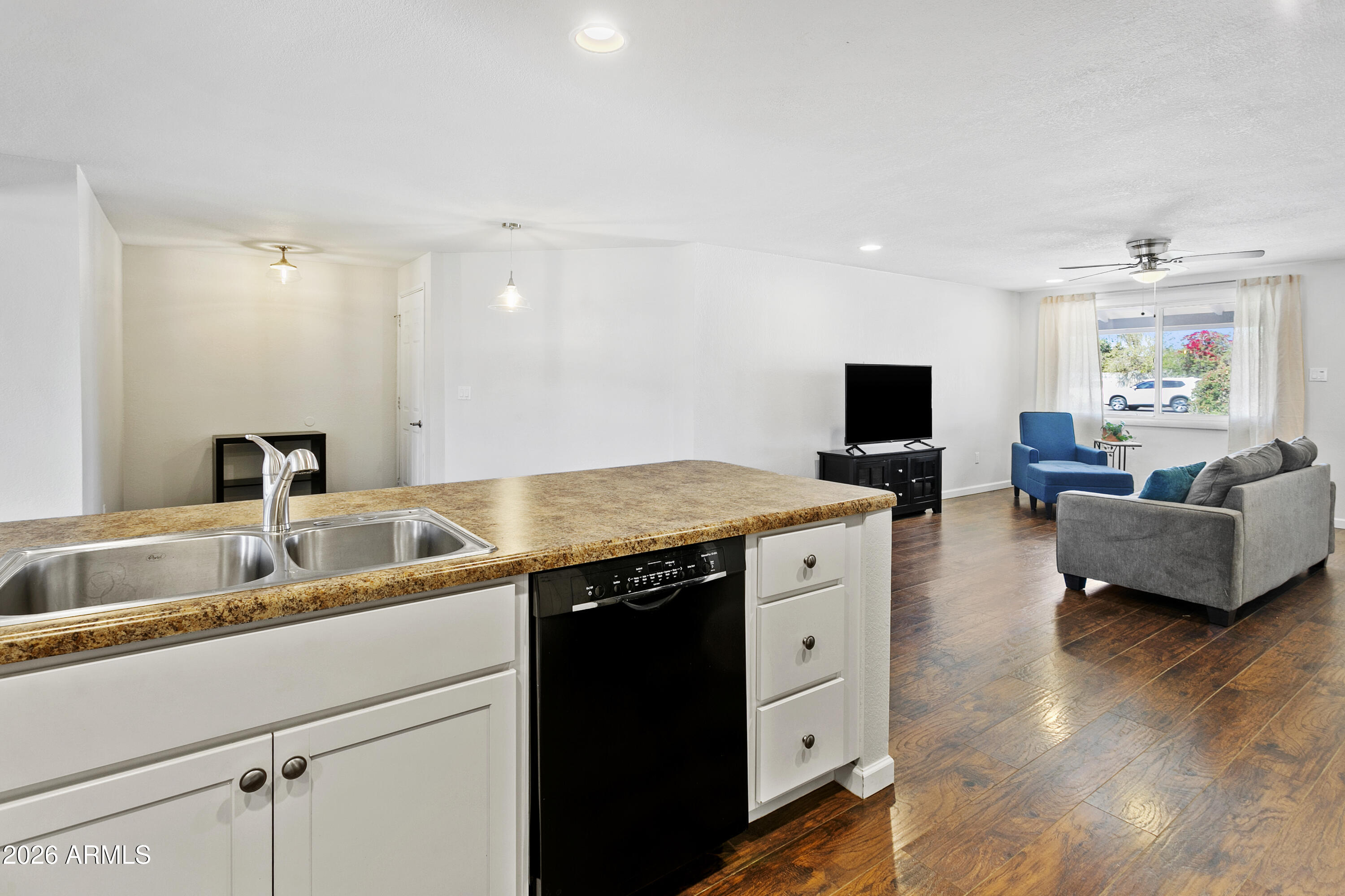 3445 East Thunderbird Road Phoenix, AZ 85032 - Photo 11 of 35 a view of center island wooden floor and windows