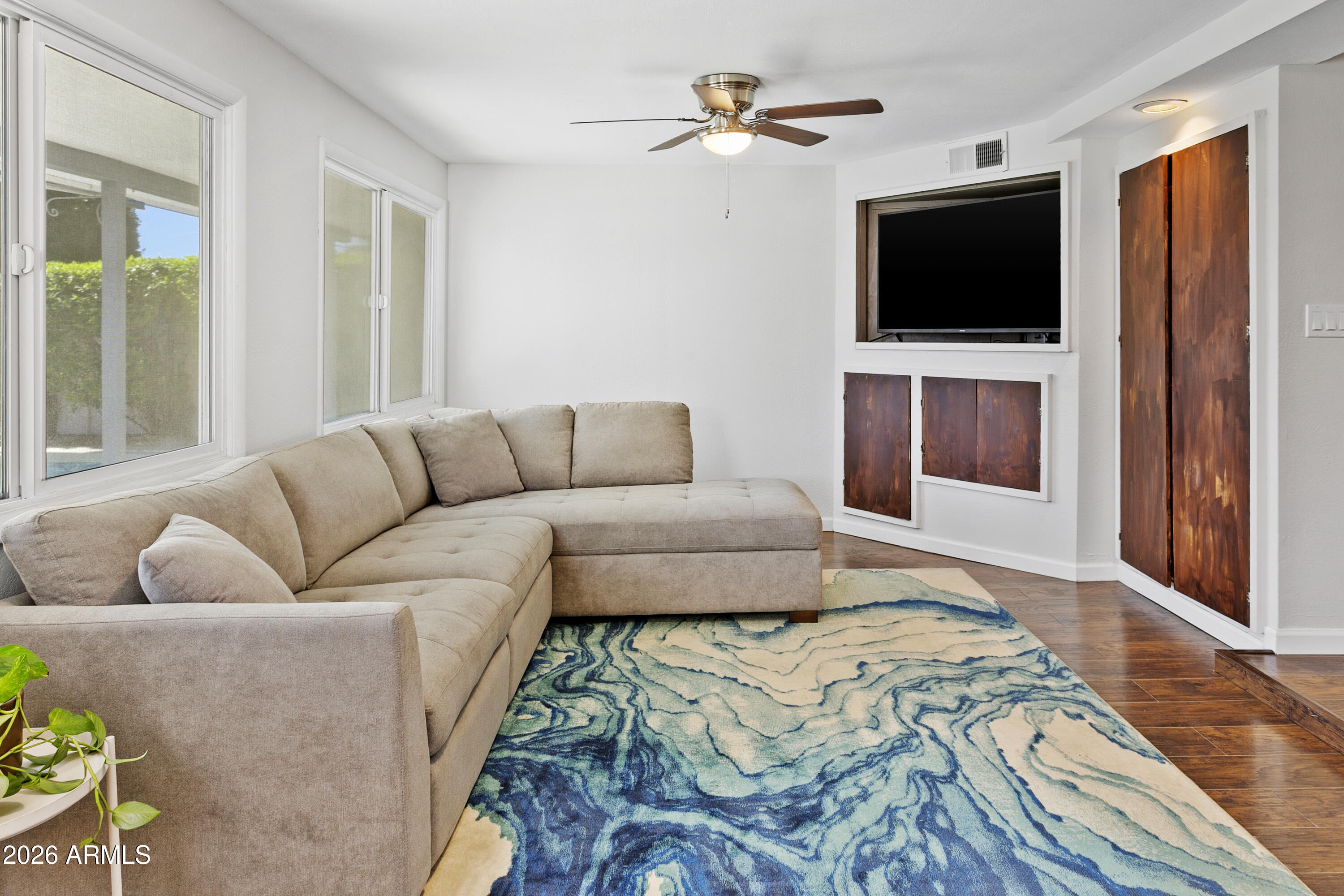 3445 East Thunderbird Road Phoenix, AZ 85032 - Photo 14 of 35 a living room with furniture and a flat screen tv