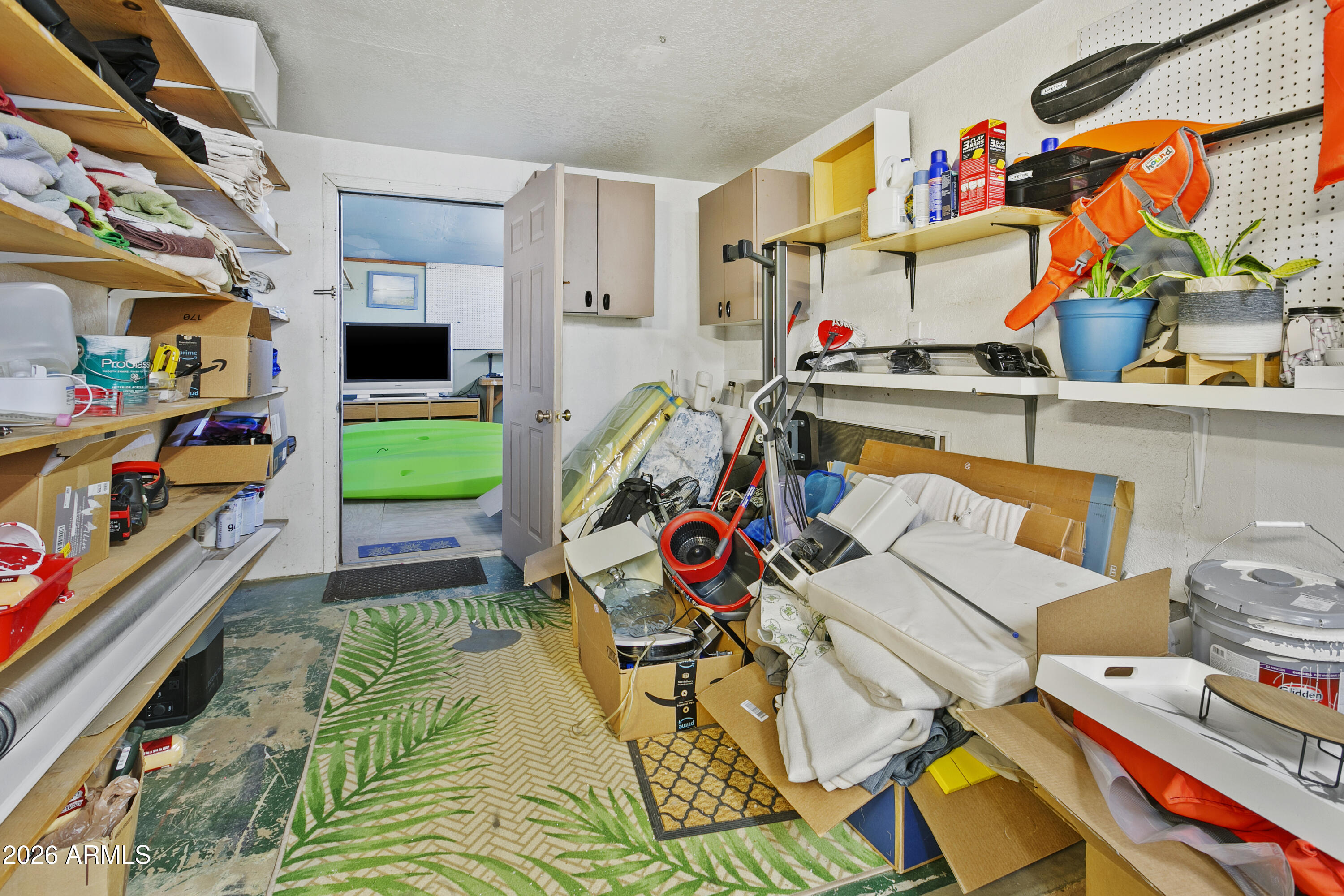 3445 East Thunderbird Road Phoenix, AZ 85032 - Photo 16 of 35 a utility room with stainless steel appliances and toys