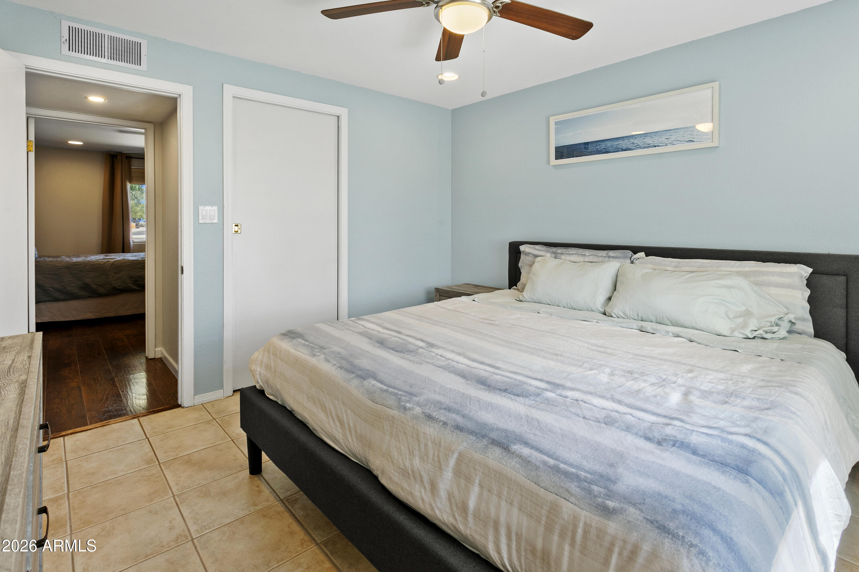 3445 East Thunderbird Road Phoenix, AZ 85032 - Photo 18 of 35 a bedroom with a bed and a walk in closet