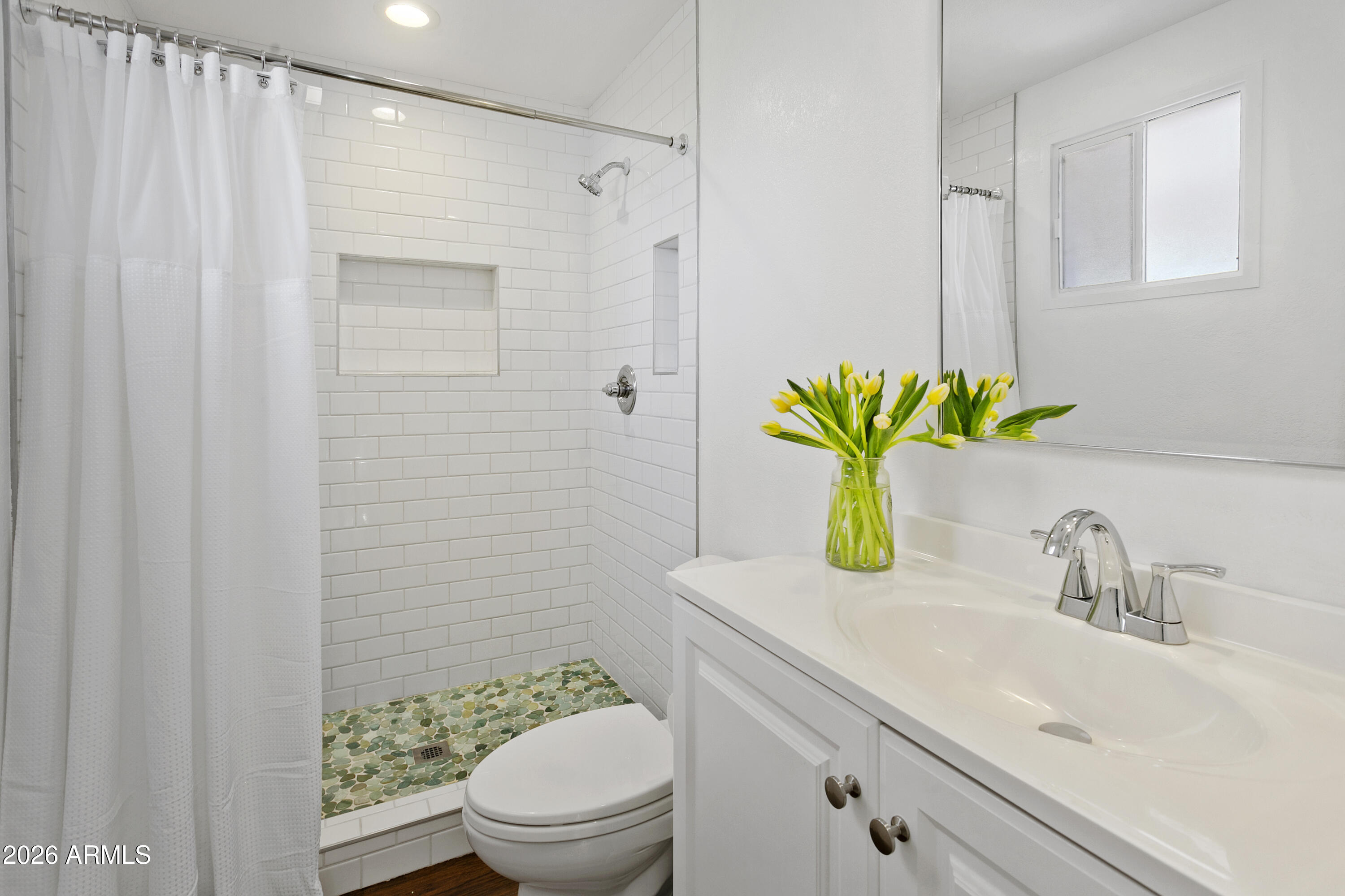 3445 East Thunderbird Road Phoenix, AZ 85032 - Photo 19 of 35 a bathroom with a sink a toilet and shower