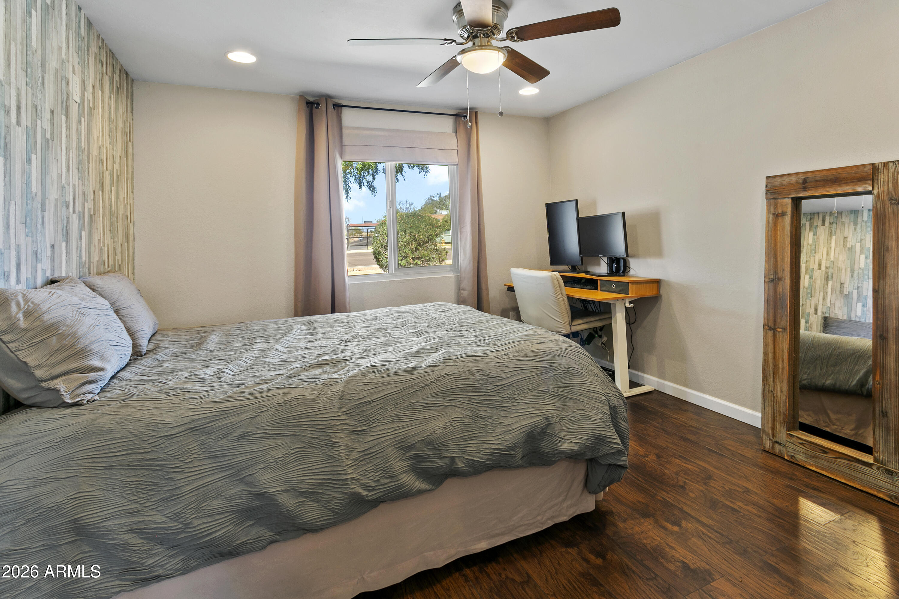 3445 East Thunderbird Road Phoenix, AZ 85032 - Photo 21 of 35 a bedroom with a bed and a flat screen tv