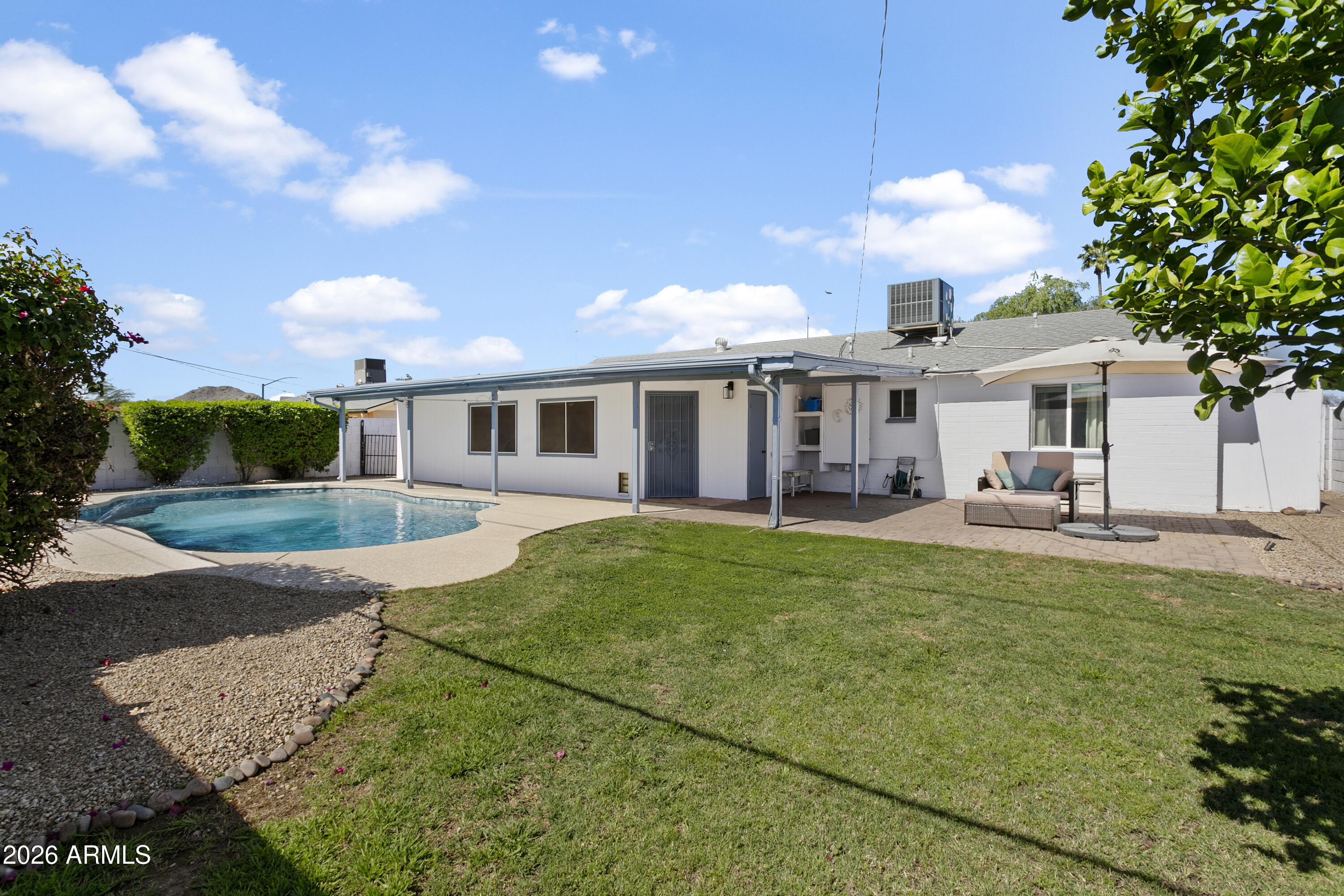 3445 East Thunderbird Road Phoenix, AZ 85032 - Photo 26 of 35 a view of a house with a backyard