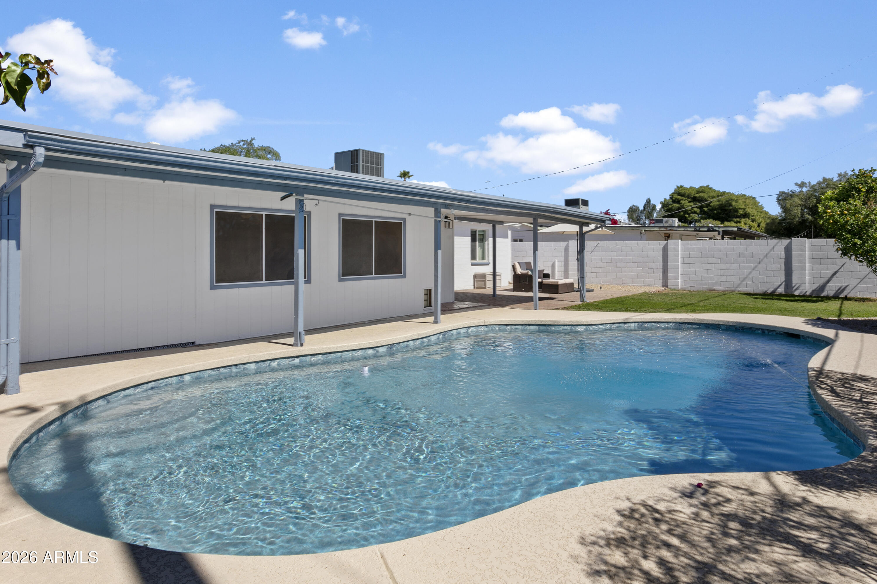 3445 East Thunderbird Road Phoenix, AZ 85032 - Photo 28 of 35 a view of a house with swimming pool