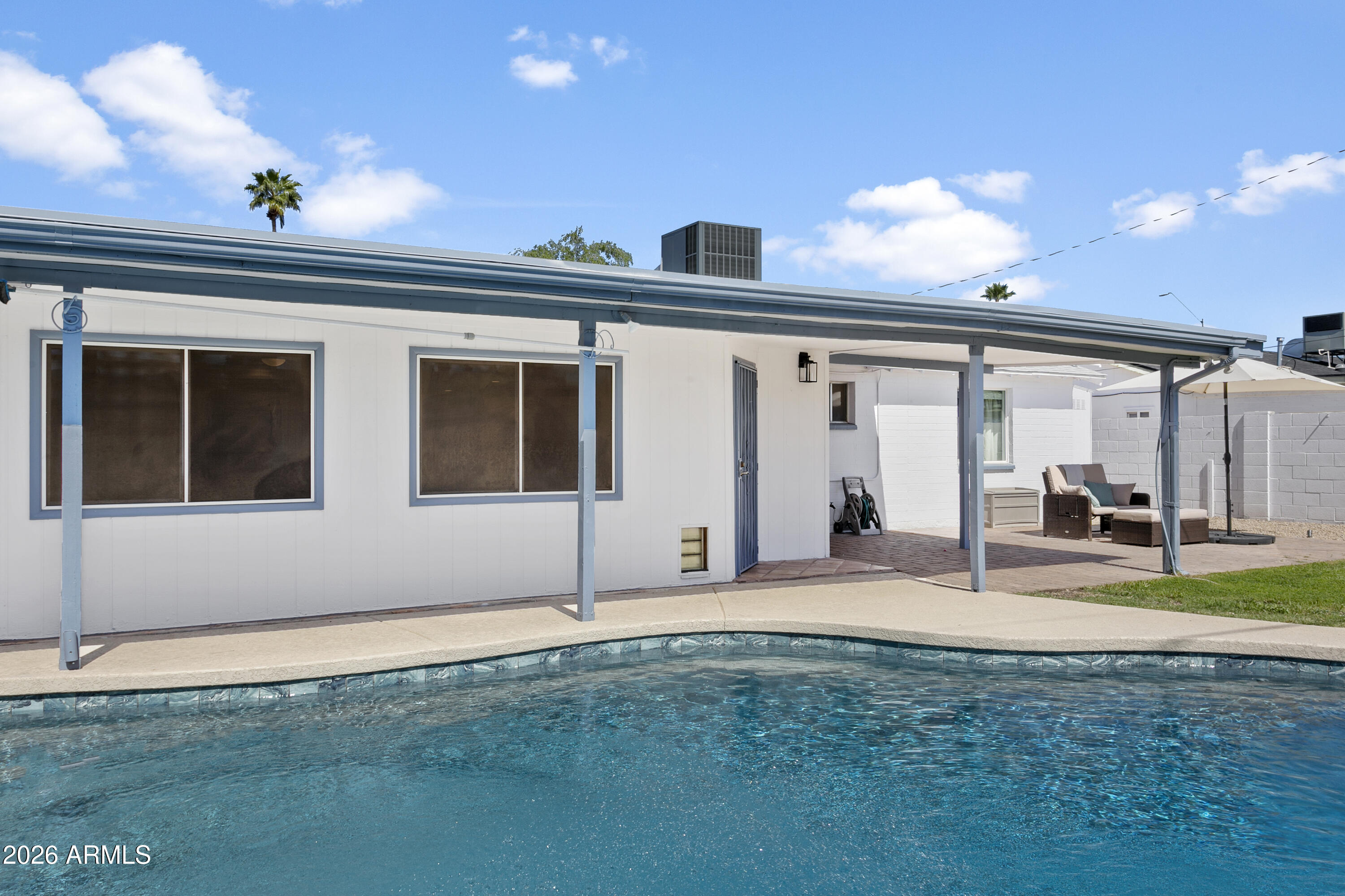 3445 East Thunderbird Road Phoenix, AZ 85032 - Photo 29 of 35 a backyard of a house with table and chairs