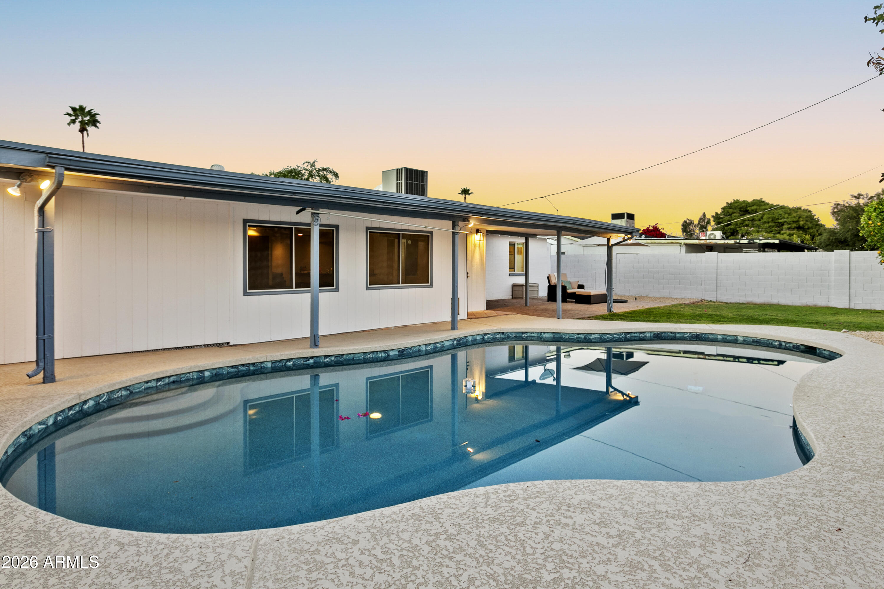 3445 East Thunderbird Road Phoenix, AZ 85032 - Photo 30 of 35 a view of a house with pool and chairs