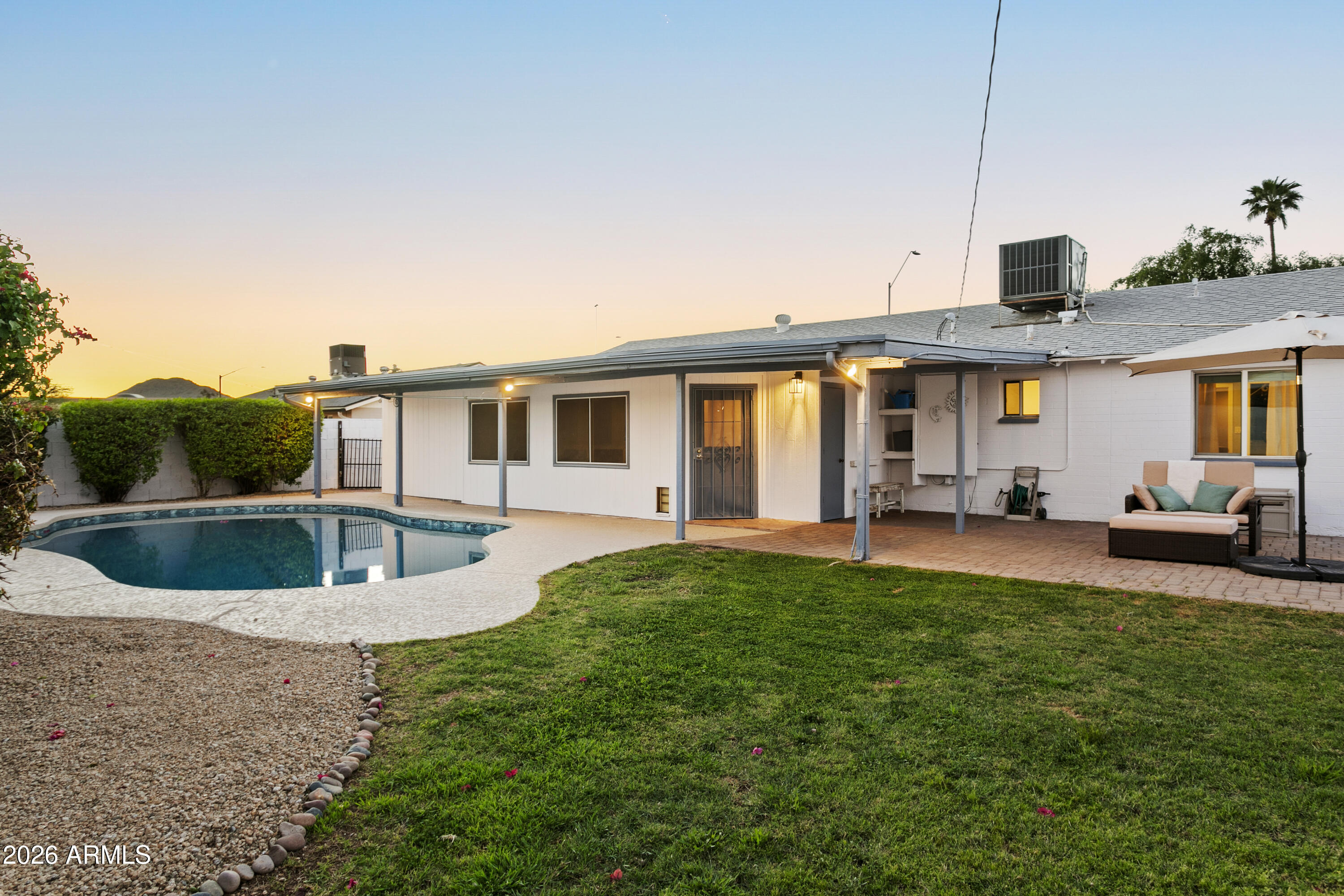 3445 East Thunderbird Road Phoenix, AZ 85032 - Photo 32 of 35 a view of a house with a backyard