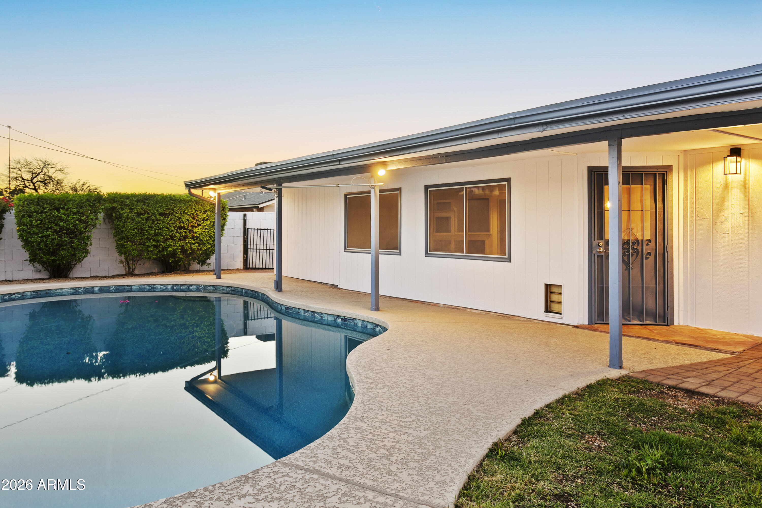 3445 East Thunderbird Road Phoenix, AZ 85032 - Photo 35 of 35 a front view of a house with a yard