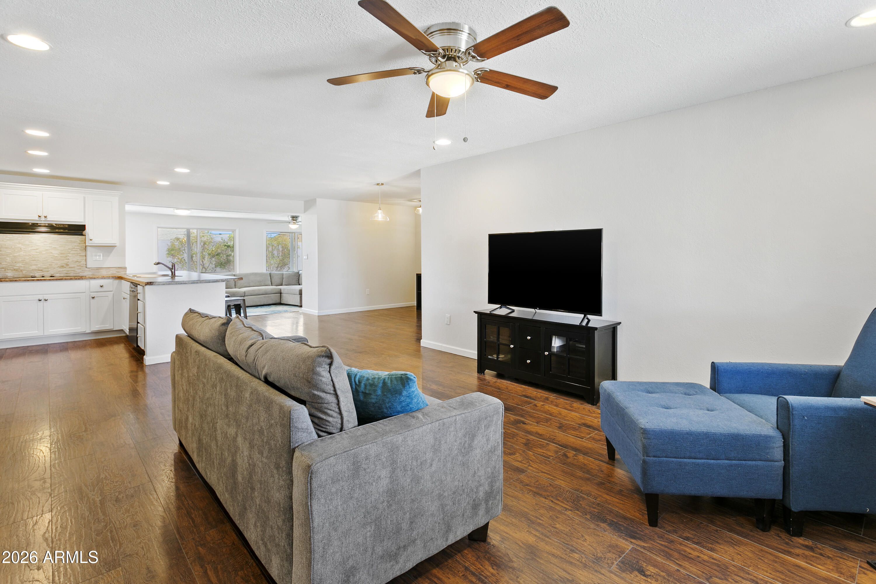 3445 East Thunderbird Road Phoenix, AZ 85032 - Photo 5 of 35 a living room with furniture and a flat screen tv