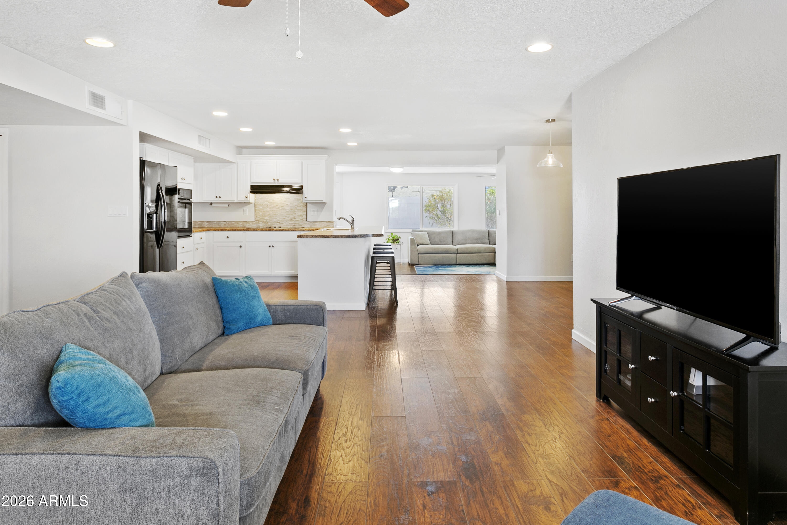 3445 East Thunderbird Road Phoenix, AZ 85032 - Photo 6 of 35 a living room with furniture and a flat screen tv