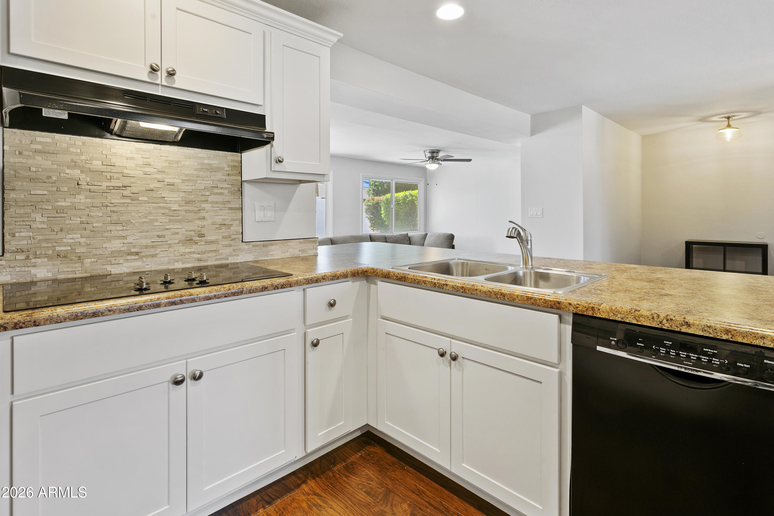 3445 East Thunderbird Road Phoenix, AZ 85032 - Photo 10 of 35 a kitchen with granite countertop cabinets stainless steel appliances and a sink