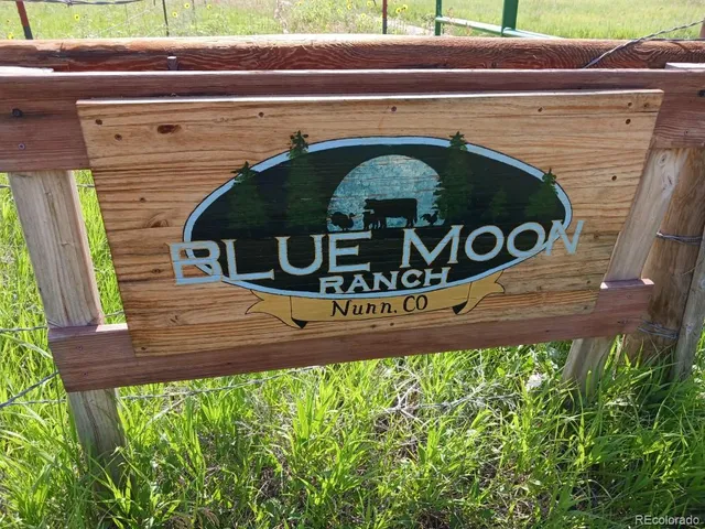 a view of a sign board with a small yard