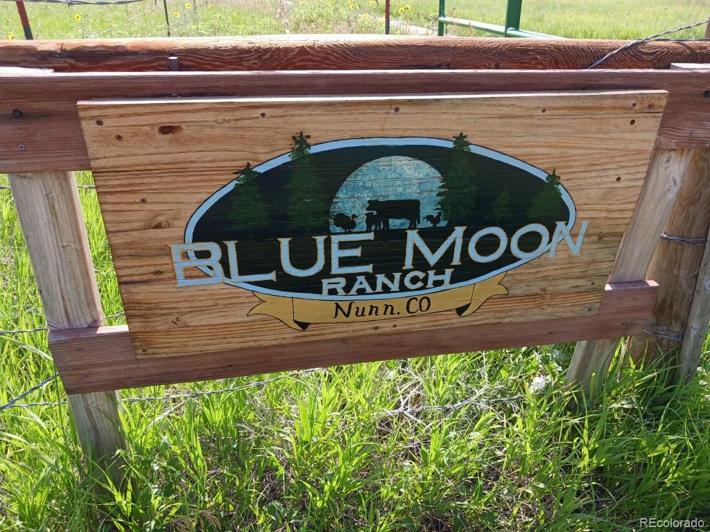 a view of a sign board with a small yard