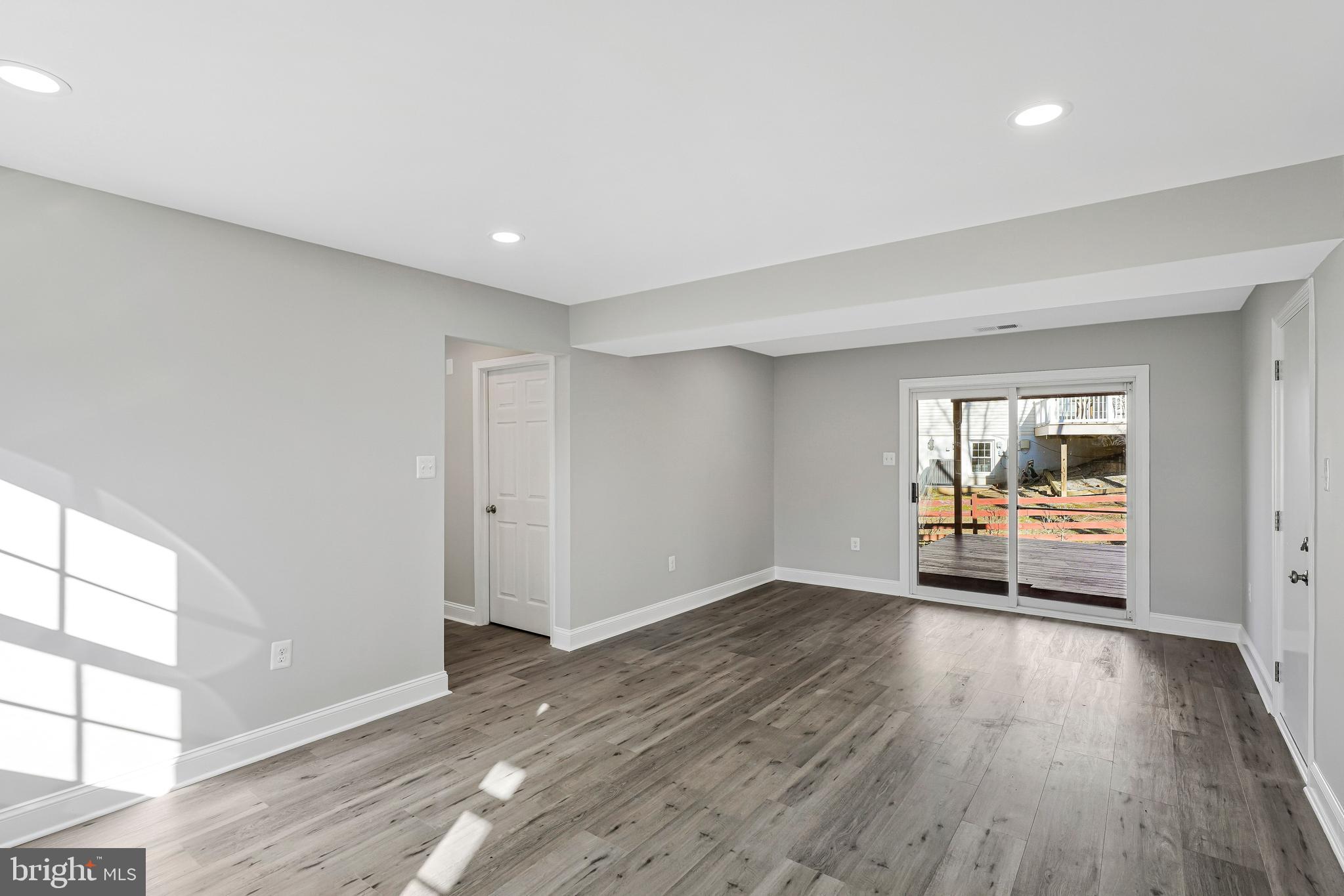 12016 Trossack Road Herndon, VA 20170 - Photo 17 of 29 New Luxury Vinyl Plank Flooring in Family Room