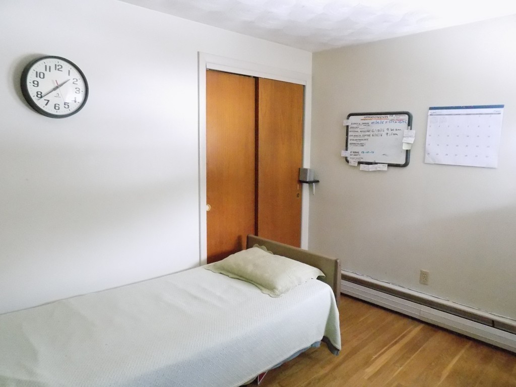 36 Blackman Road Canton, MA 02021 - Photo 14 of 20 a bedroom with a bed and a table