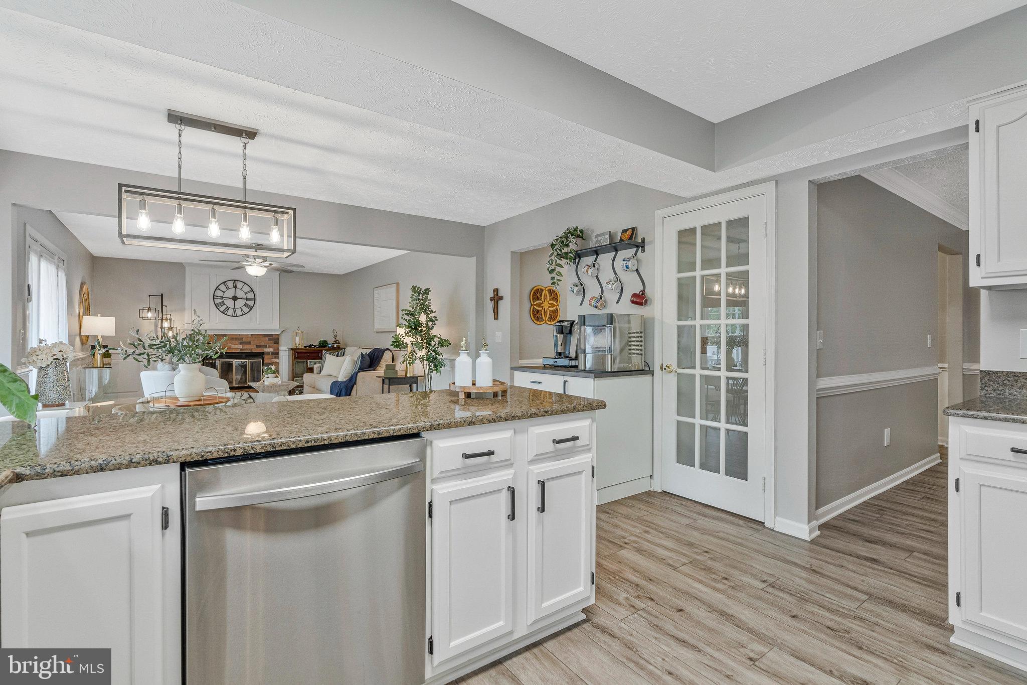 1204 James Rifle Court Northeast Leesburg, VA 20176 - Photo 15 of 51 a kitchen with cabinets and wooden floor