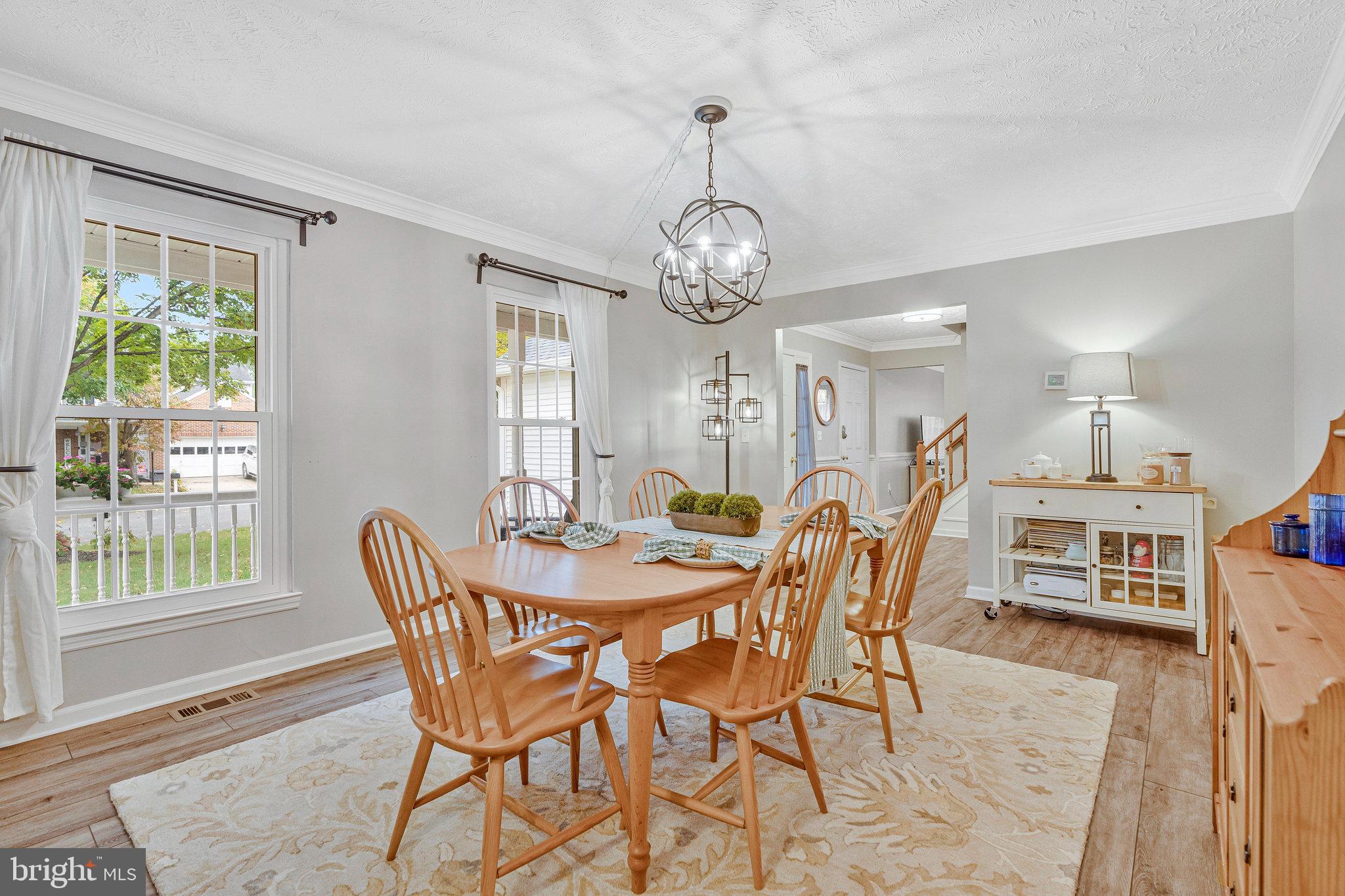 1204 James Rifle Court Northeast Leesburg, VA 20176 - Photo 17 of 51 a view of a dining room with furniture window and wooden floor