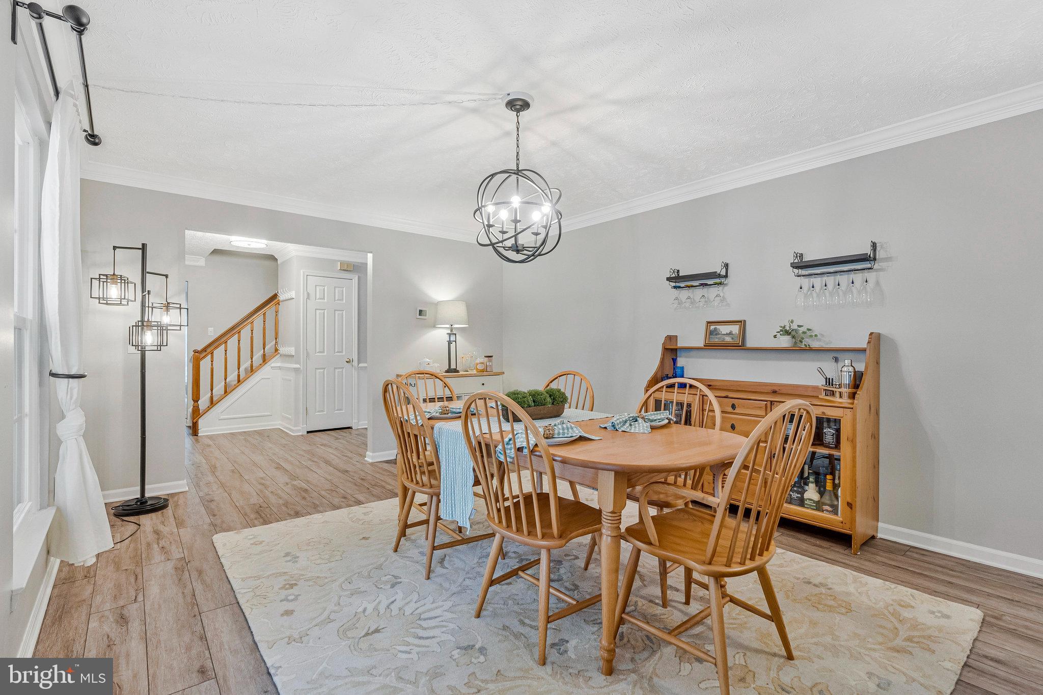 1204 James Rifle Court Northeast Leesburg, VA 20176 - Photo 18 of 51 a view of a dining room with furniture and a chandelier