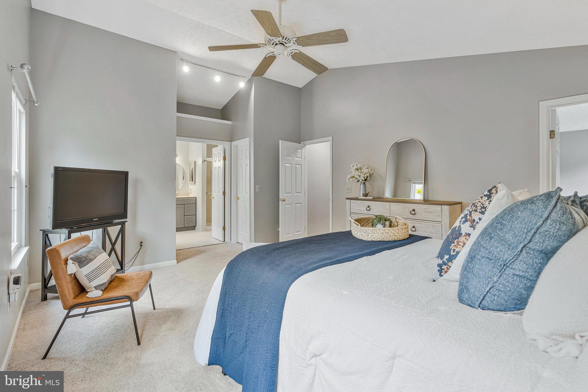 1204 James Rifle Court Northeast Leesburg, VA 20176 - Photo 26 of 51 a bedroom with a bed and a chandelier