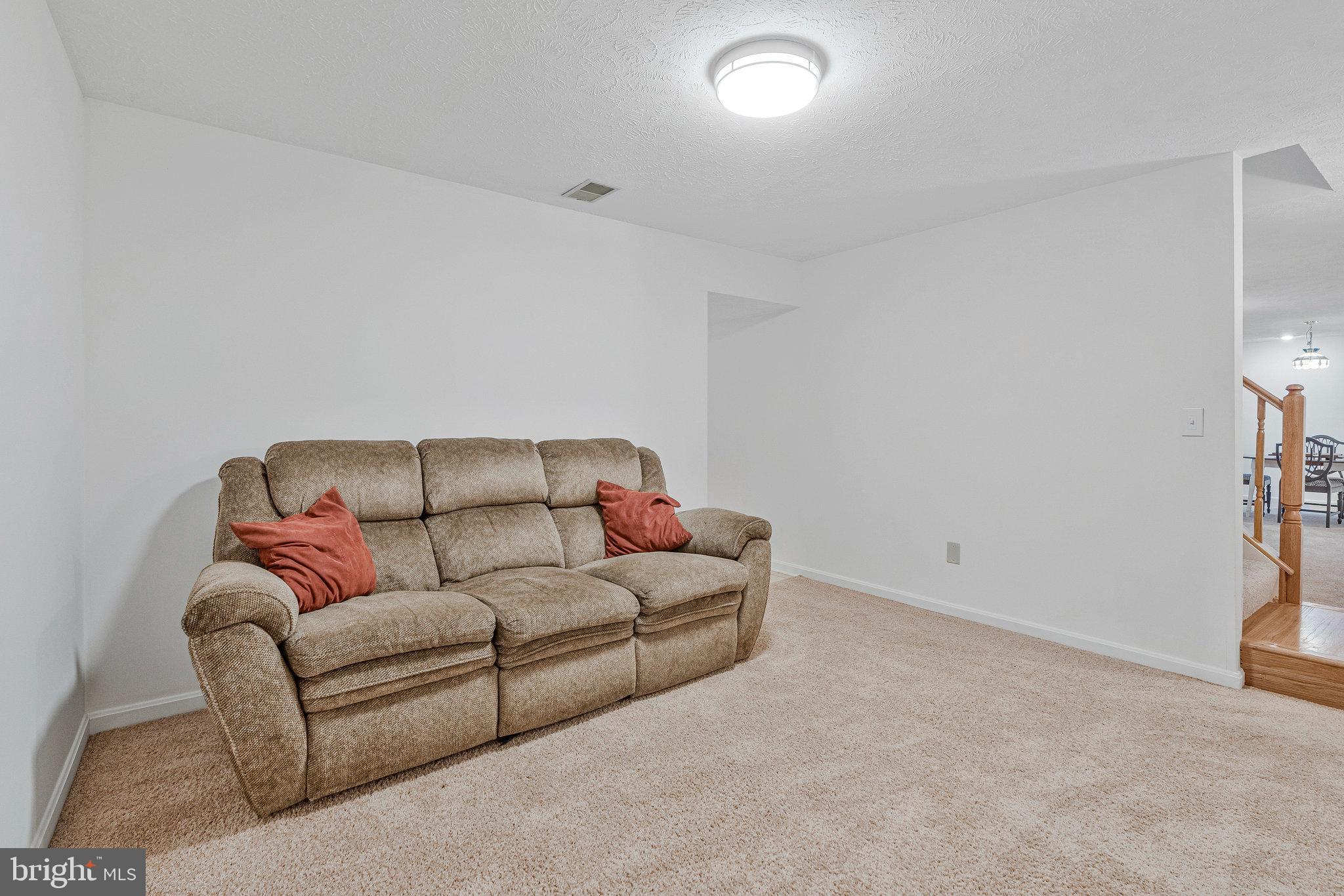 1204 James Rifle Court Northeast Leesburg, VA 20176 - Photo 43 of 51 a living room with a couch