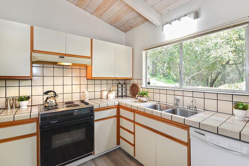1728 Cheryl Way Aptos, CA 95003 - Photo 11 of 25 a kitchen with a sink stove and cabinets