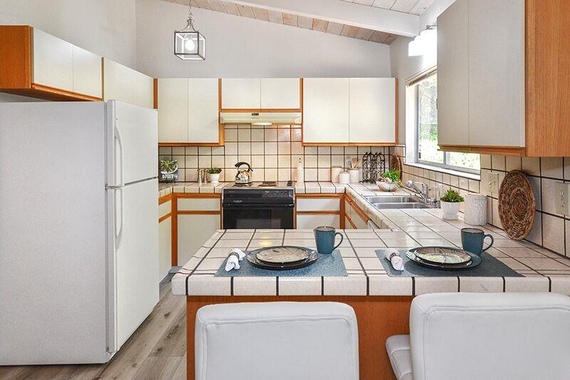 1728 Cheryl Way Aptos, CA 95003 - Photo 9 of 25 a kitchen with a refrigerator and a stove top oven