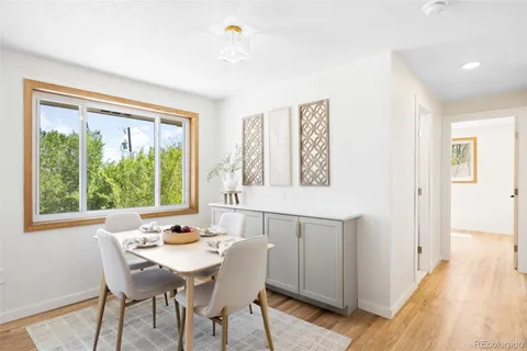 a dining room with furniture and window