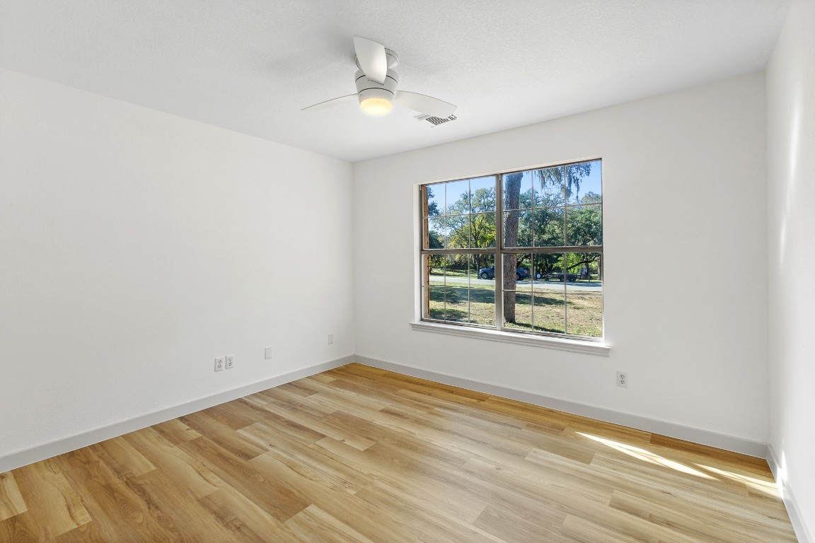 520 Hunter Ridge Road San Marcos, TX 78666 - Photo 14 of 27 a view of an empty room with a window