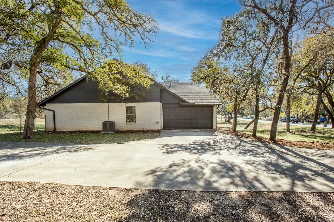 520 Hunter Ridge Road San Marcos, TX 78666 - Photo 26 of 27 a street view with wooden fence