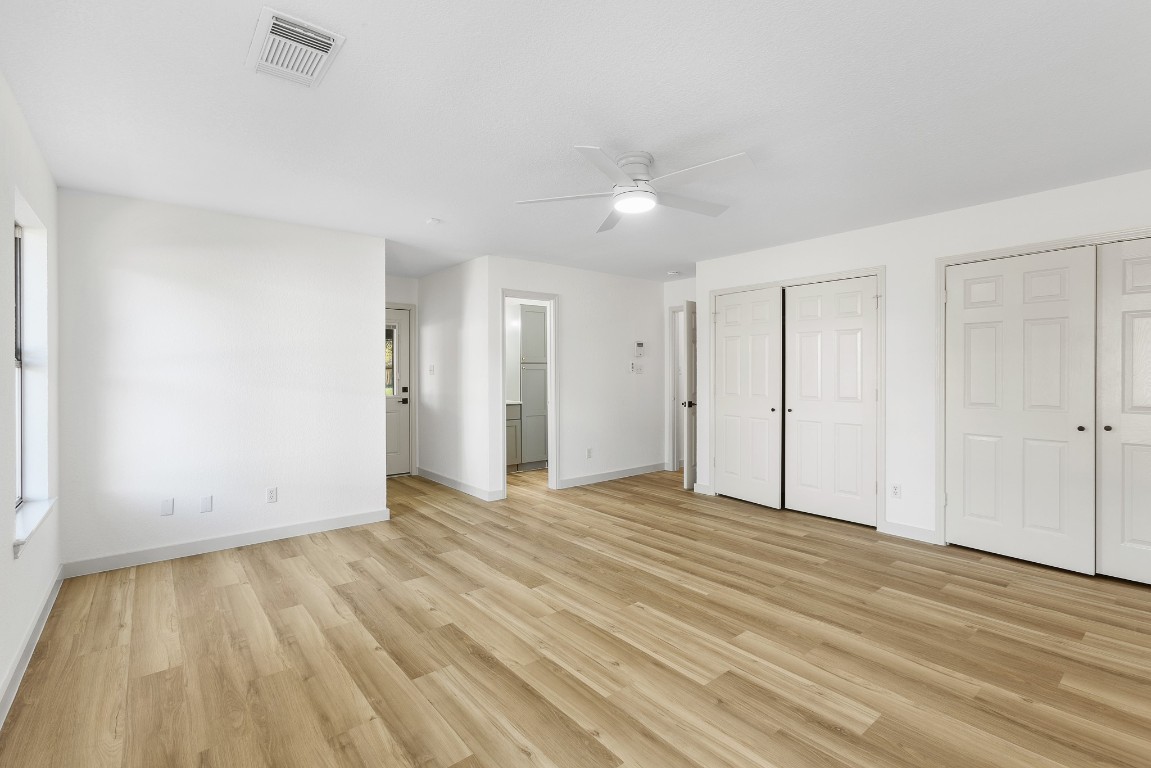 520 Hunter Ridge Road San Marcos, TX 78666 - Photo 8 of 27 a view of an empty room with wooden floor